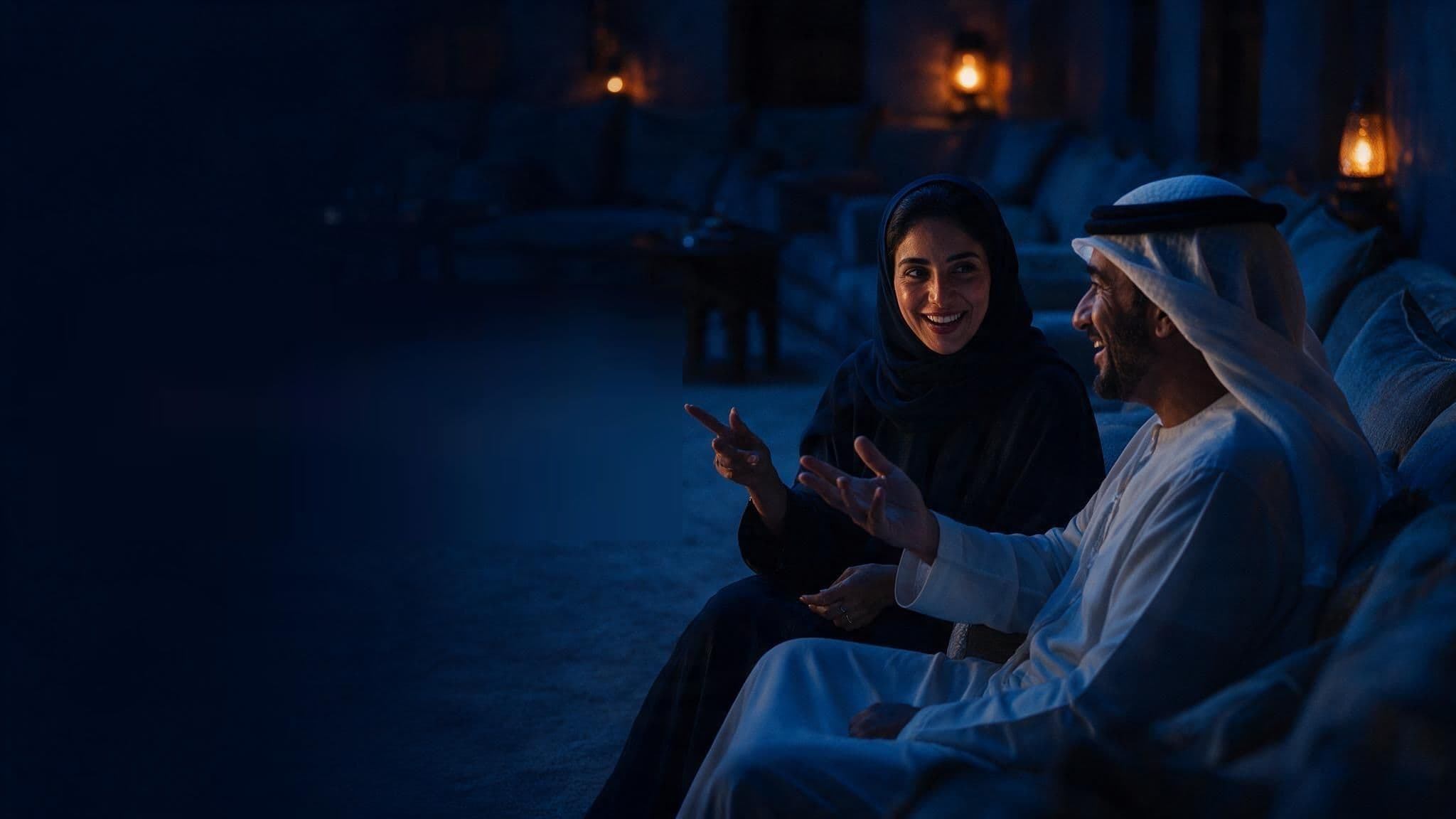 Two people in the Gulf talking and gesturing in conversation.