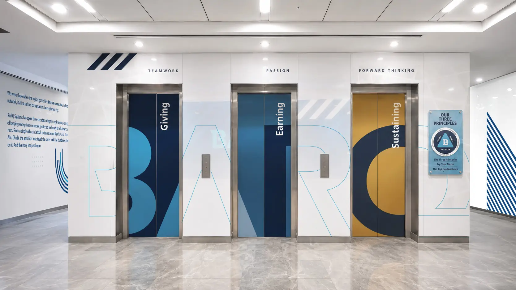 Lobby mockup with three elevator doors wrapped in giant letterforms and value words